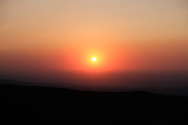 istock Beautiful sunset in foothils. Orange sun. 1286651777