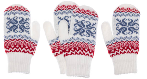 White knitted mittens with nordic geometric ornament isolated on white background White winter knitted mittens of traditional design with red and blue nordic geometric ornament isolated on white background Knitted Gloves stock pictures, royalty-free photos & images