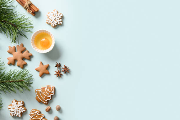 istock Christmas frame with cookies and ingredients for cooking on blue. Copy space 1286656718