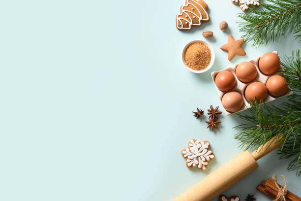 istock Christmas background with cookies and ingredients for cooking on blue. Copy space 1286657038