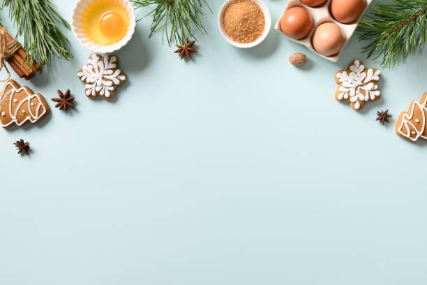 istock Christmas cookies with ingredients for cooking on blue background. Space for text. View from above. 1286657040