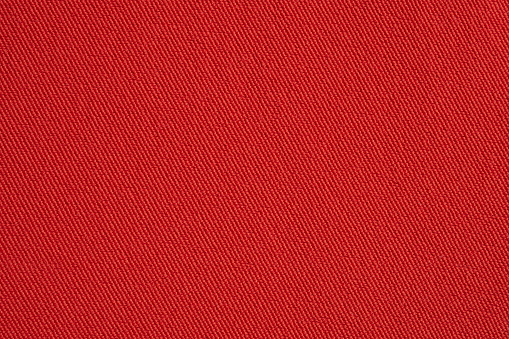 Red fabric texture background close up