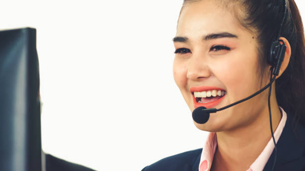 istock Business people wearing headset working in office 1286661038