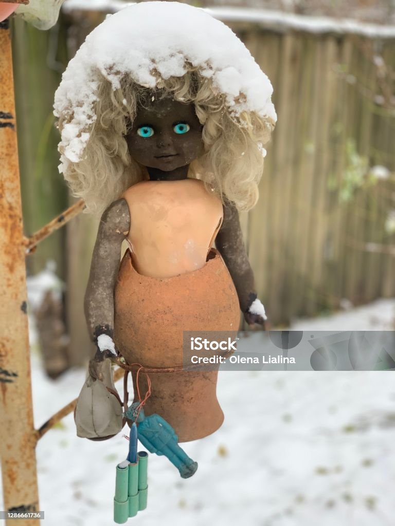 Creepy radioactive doll with piercing blue eyes and snow hair from the Chernobyl exclusion zone. Kids toy Chernobyl exclusion zone, Ukraine. 1986 Stock Photo