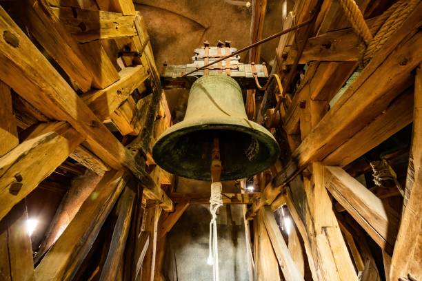 glocke im turm der kirche in cesky krumlov - church bell tower temple catholicism stock-fotos und bilder