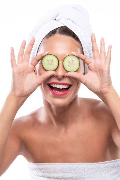 istock Lovely brunette using cucumber as a natural skin remedy 1286663148