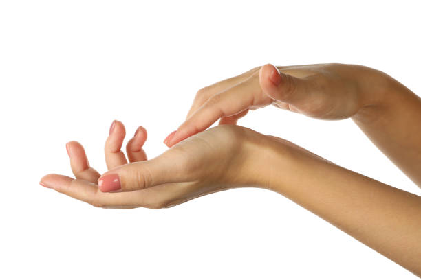 istock Cute female hands with pink manicure isolated on white background 1286663643