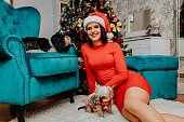 Young woman with Yorkshire terrier dogs during Chrstmas