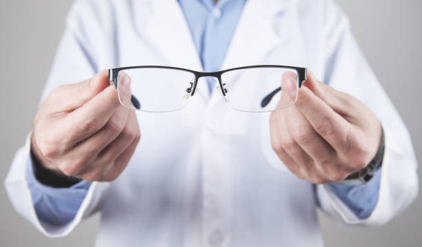 istock Caucasian professional doctor showing eyeglasses. 1286663853