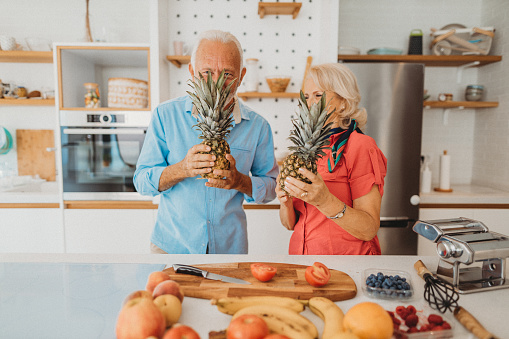Senior couple preparing vegan meal