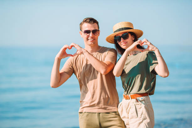 istock Young couple on white beach during summer vacation. 1286665628