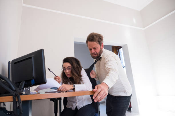 istock Man slips and falls over his female co-worker 1286665746