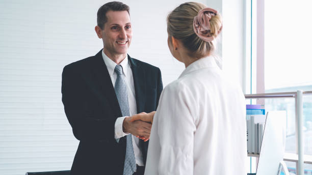 istock Business people handshake in corporate office 1286667002