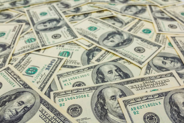 istock heap of US dollar as a background 1286668673