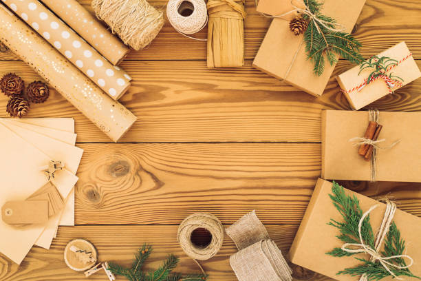 istock Gift boxes for various holidays, Christmas, Valentine's Day, on a wooden background. Zero waste concept, environmental protection.Flat lay 1286668760
