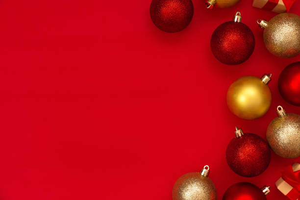 istock Red and gold Christmas balls decorations on a red background with copy space.Christmas composition. Flat lay, top view. Minimalistic style. 1286669647