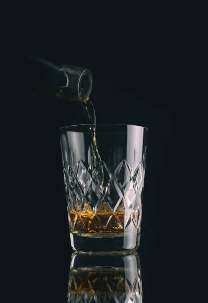 istock Pouring A Glass Of Scotch Whisky 1286671105