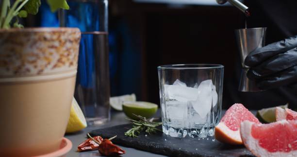 istock Human hands are making a mocktail with various citrus juices and rosemary 1286671383