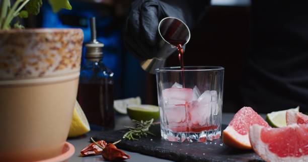 istock Human hands are making a mocktail with various citrus juices and rosemary 1286671391