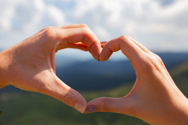 istock The couple folded their hearts with their hands. Beautiful mountains 1286672282