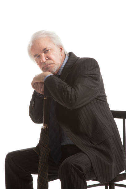 istock Senior businessman with umbrella 1286674280