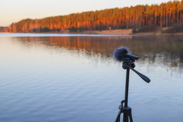 istock Portable recorder stands on a tripod on the lake shore 1286678426