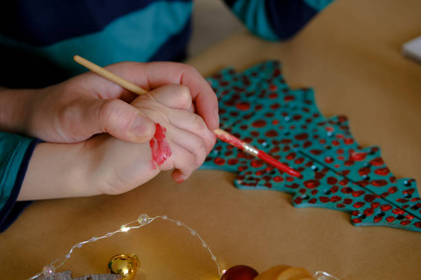 istock Father helping child making christmas decorations 1286681527