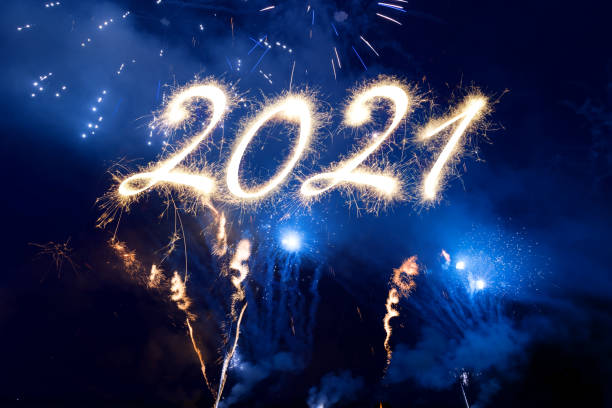 istock Sparkler Happy New Year 2021 With Fireworks 1286684191