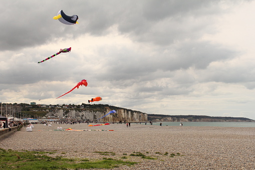Dieppe, France - sep 8, 2018: kites are flying at the alabaster coast in dieppe, normandy during an international kite festival in summer