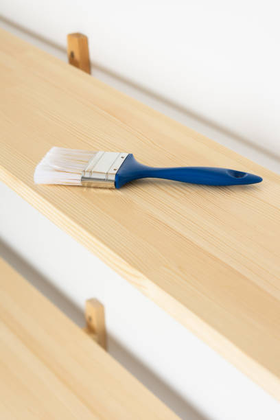 istock Paint brush on a wooden shelf 1286685177
