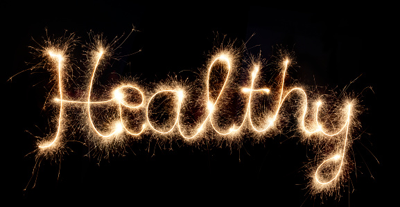 Sparkler font with the word healthy on black background