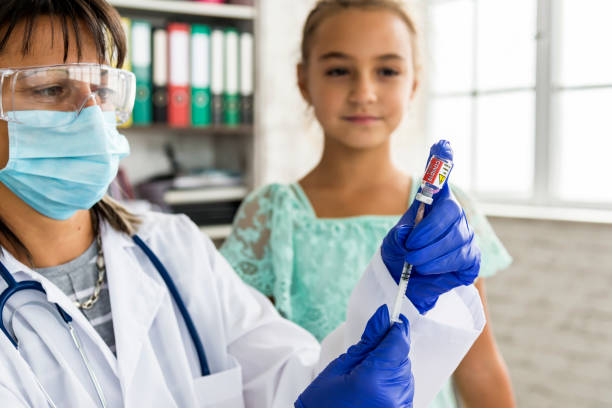 istock A pediatrician vaccinates a child against COVID 19 1286688481
