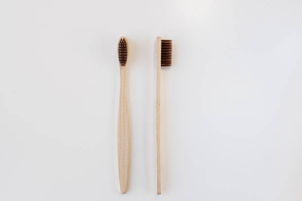 istock View of bamboo toothbrush front and side. Horizontal orientation. Dental zero waste and no plastic concept. Copy space, top view. Natural organic white brush. Isolated on white background. 1286689502