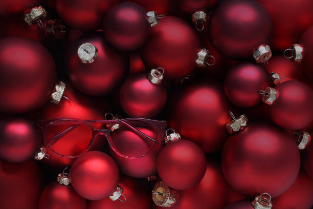 istock merry christmas, eyeglasses red spectacles on balls background, useful as a greeting gift card or promotional template with copy space 1286689526