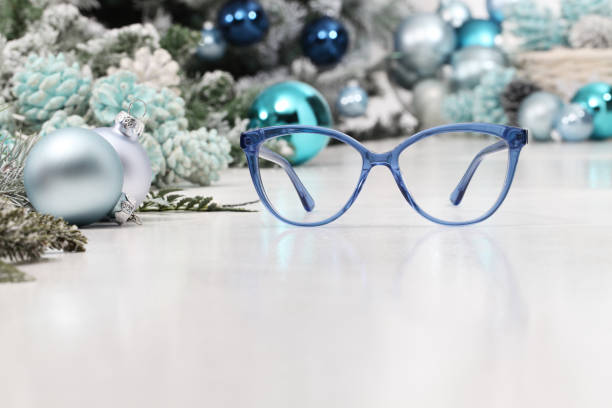 istock christmas eyeglasses blue spectacles isolated on white table with balls and decorations useful as a greeting gift card template with copy space 1286689536