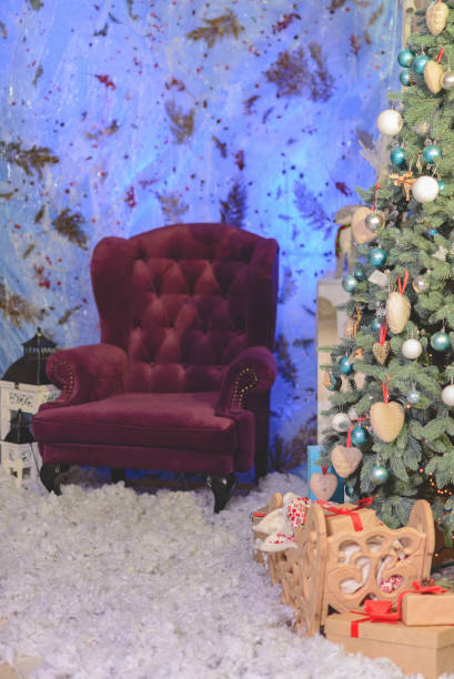 istock Santa's red armchair near the Christmas tree 1286689655