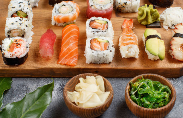 istock Sushi Set nigiri and sushi rolls on a wooden tray 1286691233