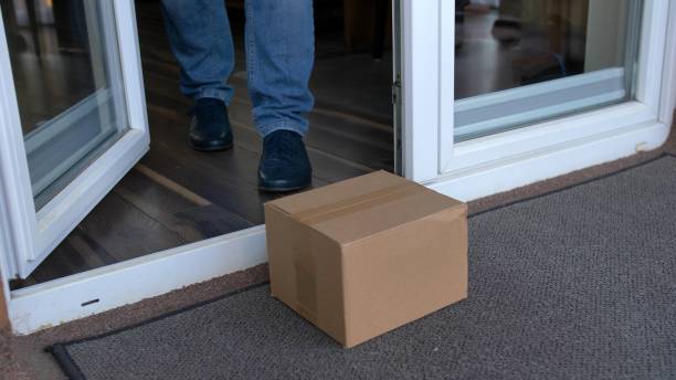 istock Picking Up a Package in Protective Blue Gloves In Epidemic Virus Times POV 1286691423