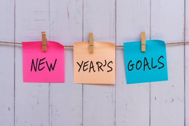 istock New Year's Goals text on colorful paper note hanging with clothespin 1286691465