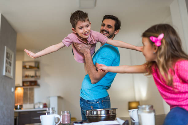 istock Happy family making cake together 1286692661