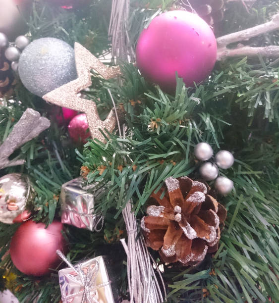 istock Colored balls hanging on a branch of a Christmas tree. 1286694474