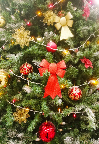 istock Colored balls hanging on a branch of a Christmas tree. 1286694529