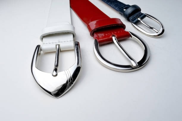 istock white, red, blue womens belts with glossy plaques on a white background. 1286695567
