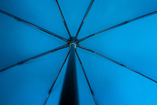 istock Blue fabric open umbrella mechanism inside point of view concept. 1286695930