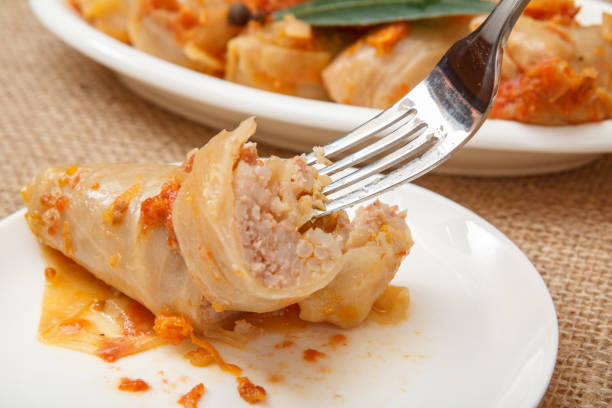 istock Fork with homemade cabbage rolls stuffed with rice and meat. 1286698944