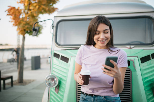 istock Happy young Caucasian woman using a smart phone 1286700131