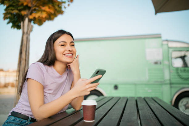 istock Happy young Caucasian woman using a smart phone 1286700158
