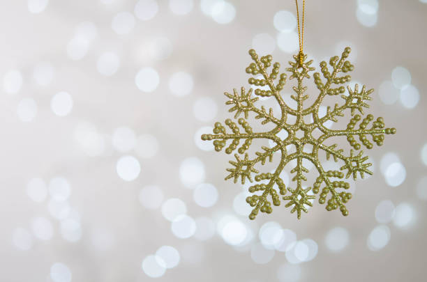 istock Golden toy snowflake. Bokeh. Silver Christmas lights. 1286700164