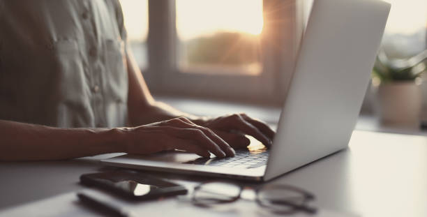 istock Woman working from home. Student girl using laptop in office 1286701754