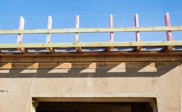 Photo of Construction of the roof gable. Wooden formwork.